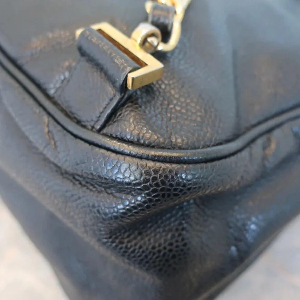 Authentic CHANEL black caviar leather backpack